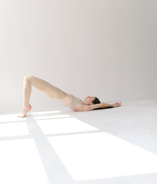Woman in a calm yoga pose, embodying balance and grace.
